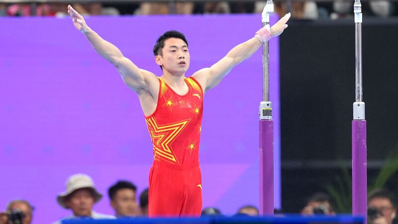 China_s_Zou_Jingyuan_Aims_to_Defend_Parallel_Bars_Gold_at_Paris_Olympics_poster - Khabar Asia China_s_Zou_Jingyuan_Aims_to_Defend_Parallel_Bars_Gold_at_Paris_Olympics video poster
