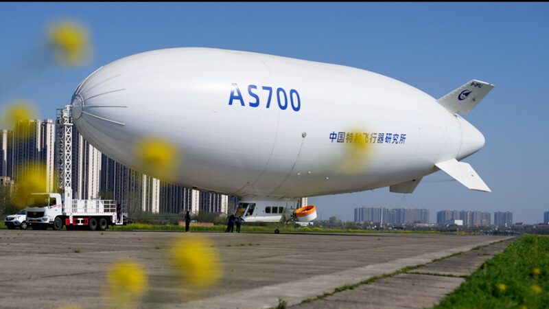 Chinas_AS700_Airship_Completes_Successful_First_Ferry_Flight_poster - Khabar Asia China's AS700 Airship Completes Successful First Ferry Flight video poster