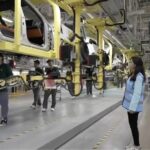 China's Electric Vehicle Industry Sets Global Standards Amid Tariff Tensions video poster