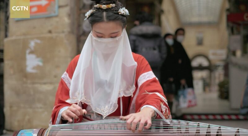 Chinese_Musician_Mesmerizes_Paris_with_Traditional_Guzheng_Performances_poster - Khabar Asia Chinese Musician Mesmerizes Paris with Traditional Guzheng Performances video poster