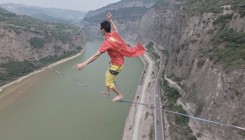 Chinese_Slackliner_Attempts_Record-Breaking_600-Meter_Yellow_River_Crossing_poster - Khabar Asia Chinese Slackliner Attempts Record-Breaking 600-Meter Yellow River Crossing video poster