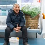Chongqing Welcomes Farmers with Bamboo Baskets on Subway Amid Urban Expansion