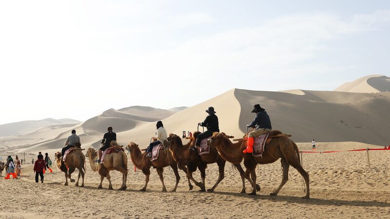 Desert_Symphony__Mingsha_Mountain_and_Crescent_Spring_s_Timeless_Allure - Khabar Asia Desert_Symphony__Mingsha_Mountain_and_Crescent_Spring_s_Timeless_Allure