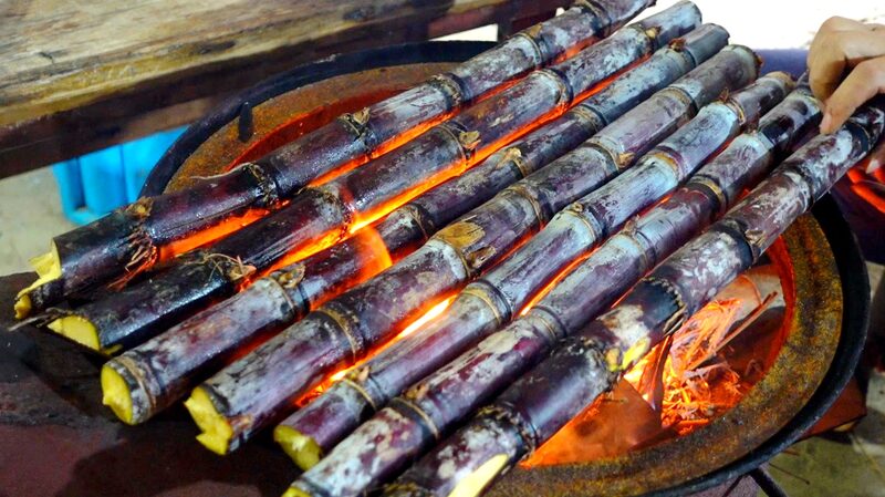 Discover_the_Smoky_Sweetness_of_Grilled_Sugarcane_in_Hainan - Khabar Asia Discover the Smoky Sweetness of Grilled Sugarcane in Hainan
