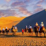 Embark on a Camel Ride Across Mingsha Mountain in China's Gansu Province video poster
