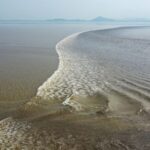 Experience the World's Largest Tidal Bore on the Qiantang River video poster