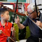 Four_Generations_of_Erhu_Players_Unite_Through_Music_in_Jiangsu_Province video poster