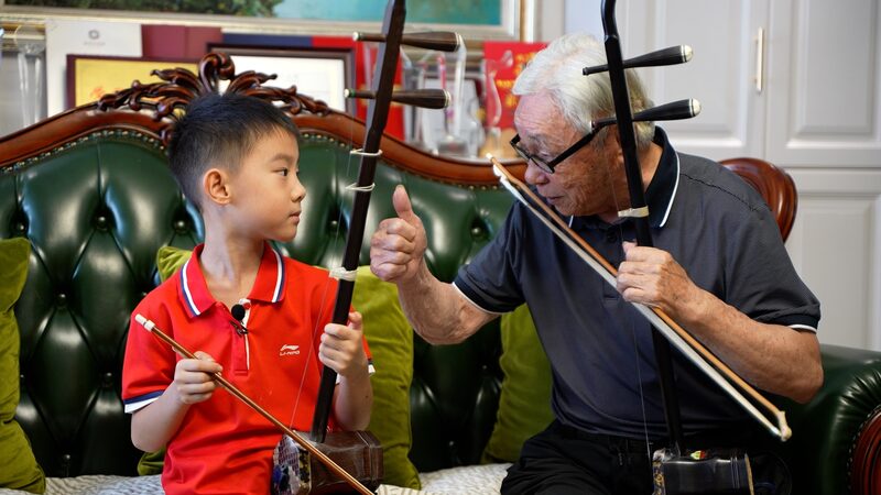 Four_Generations_of_Erhu_Players_Unite_Through_Music_in_Jiangsu_Province video poster