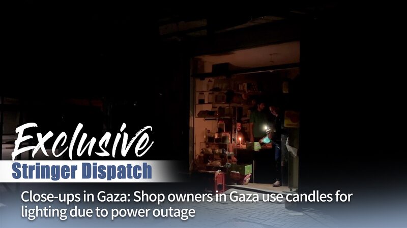 Gaza_Shop_Owners_Rely_on_Candles_Amid_Widespread_Power_Outages_poster - Khabar Asia Gaza Shop Owners Rely on Candles Amid Widespread Power Outages video poster
