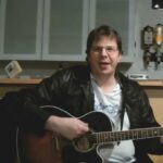 German Executive Composes Song to Support Wuhan's Fight Against COVID-19 video poster