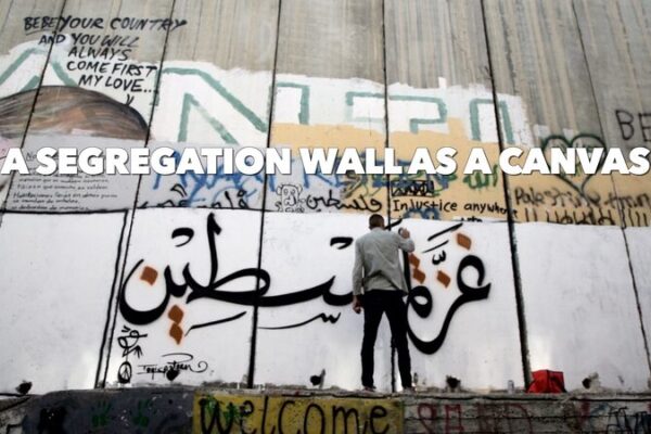 Palestinian Artist Turns Segregation Wall into Canvas of Peace Palestinian Artist Turns Segregation Wall into Canvas of Peace video poster