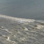 Qiantang River's Spectacular Tidal Bore: Witness Nature's Power in East China video poster