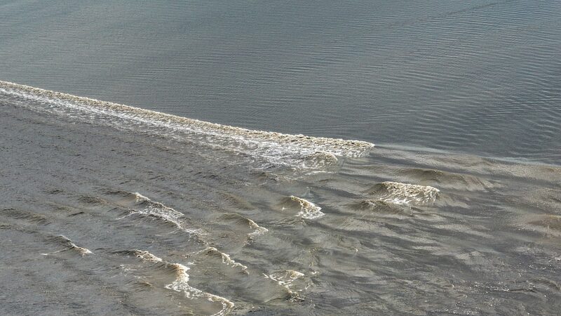 Qiantang River's Spectacular Tidal Bore: Witness Nature's Power in East China video poster