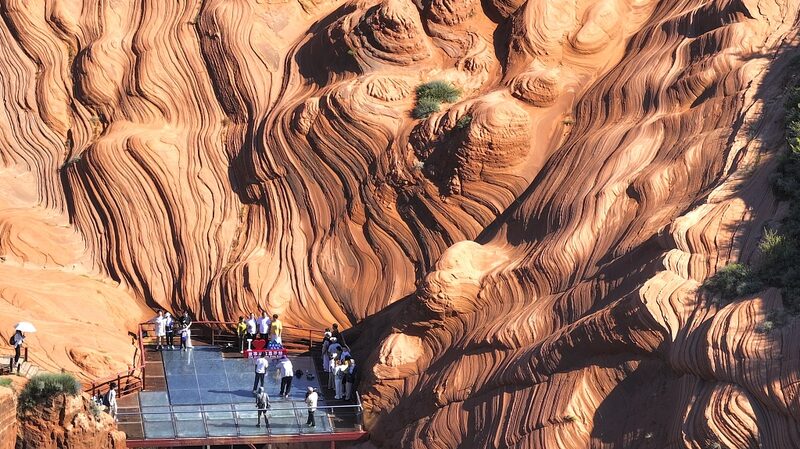 Rain_Enhances_Danxia_s_Wave_Valley__A_Spectacular_Display_of_Nature_s_Artistry - Khabar Asia Rain_Enhances_Danxia_s_Wave_Valley__A_Spectacular_Display_of_Nature_s_Artistry