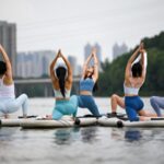 Shenyang_Yoga_Instructors_Flex_on_Paddleboards_on_the_Hunhe_River