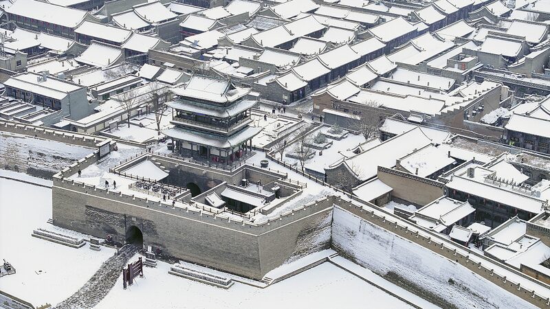 Snow Transforms Pingyao Ancient City into a Winter Wonderland