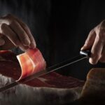 Spains_Iberian_Ham_From_Acorn-Fed_Pigs_to_Chinas_Tables_poster - Khabar Asia Spain's Iberian Ham: From Acorn-Fed Pigs to China's Tables video poster