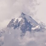 Swirling Clouds Envelop Meili Snow Mountain's Mystical Peak