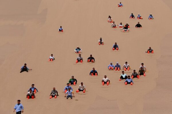 Thrilling Sand Sliding Adventures in Gansu’s Mingsha Mountain Thrilling Sand Sliding Adventures in Gansu's Mingsha Mountain video poster