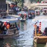Tourists Celebrate Spring Festival with Scenic Boat Tours in Huzhou's Nanxun Ancient Town