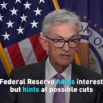 U_S__Federal_Reserve_Holds_Interest_Rates_Steady__Hints_at_Possible_Cuts_Ahead video poster