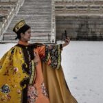 Visitors in Hanfu Grace Beijing's Forbidden City Amid Snowfall