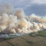 Western Canada's Wildfires Spark Evacuations and Global Climate Concerns