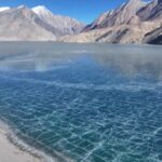 Where_Ice_Meets_Sand__Xinjiang_s_Baisha_Lake_Stuns_with_Rare_Frozen_Beauty