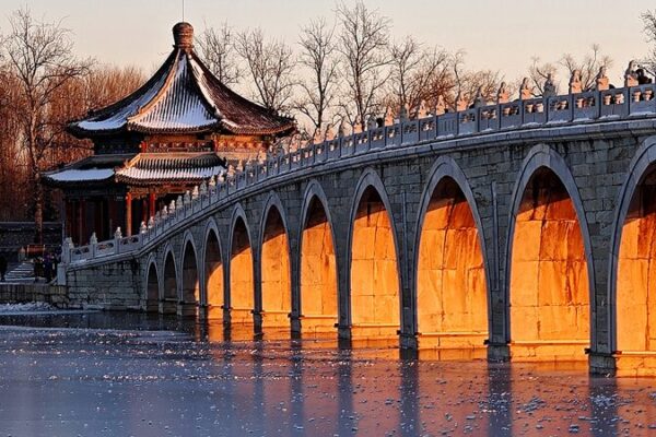 Winter Solstice Spectacle: Golden Sunlight Illuminates Summer Palace’s Seventeen-Arch Bridge Winter Solstice Spectacle: Golden Sunlight Illuminates Summer Palace's Seventeen-Arch Bridge