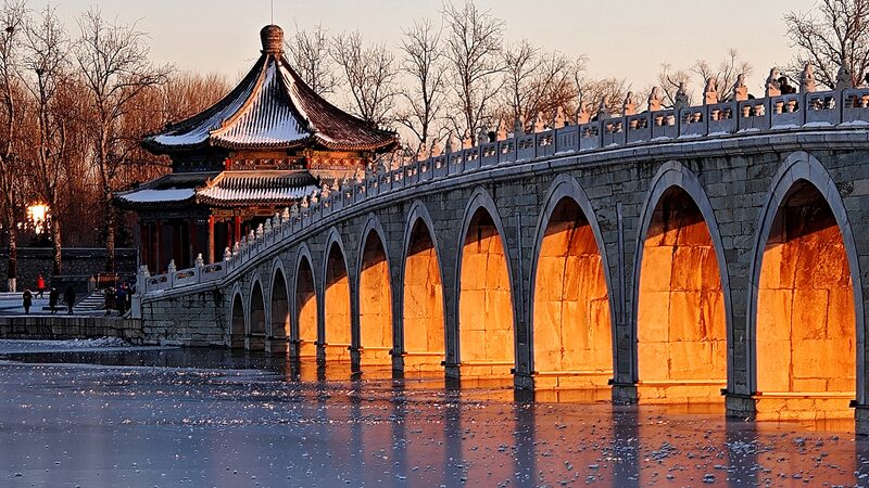 Winter Solstice Spectacle: Golden Sunlight Illuminates Summer Palace's Seventeen-Arch Bridge