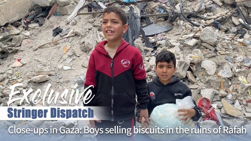 Young_Gazans_Sell_Biscuits_Amid_Ruins_of_Rafah_to_Survive_Conflict_poster - Khabar Asia Young Gazans Sell Biscuits Amid Ruins of Rafah to Survive Conflict video poster