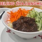 Zhajiangmian__Beijing_s_Iconic_Noodle_Dish_Reflecting_Local_Food_Culture video poster