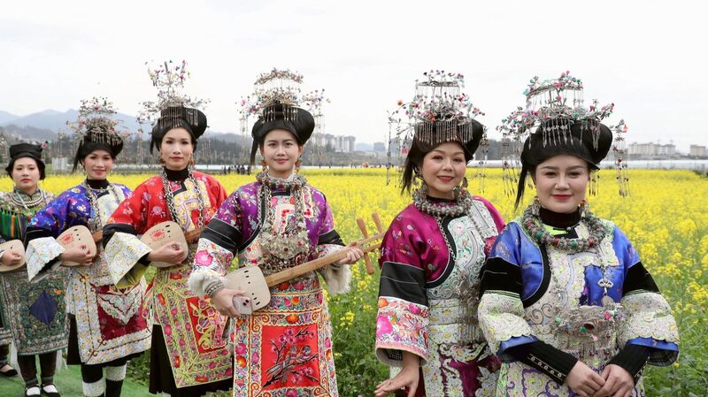 Guizhou_Villagers_Celebrate_Ethnic_Culture_Amid_Blooming_Rapeseed_Fields
