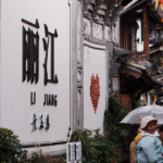 Lijiang_Blooms__Ancient_Town_Glows_with_Spring_Lights_and_Timeless_Charm