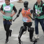 Robots_and_Runners_Race_in_Beijing_s_Historic_Tech_Driven_Marathon video poster
