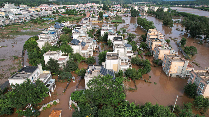 Xi_Urges_Full_Mobilization_to_Protect_Lives_Amid_China_Flood_Crisis - Khabar Asia Xi_Urges_Full_Mobilization_to_Protect_Lives_Amid_China_Flood_Crisis