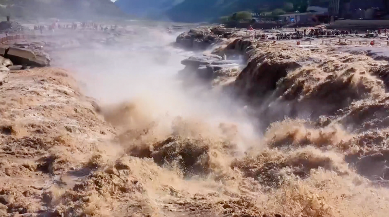China_s_Hukou_Waterfall_Dazzles_with__Golden_Waves__Spectacle_poster - Khabar Asia China_s_Hukou_Waterfall_Dazzles_with__Golden_Waves__Spectacle video poster
