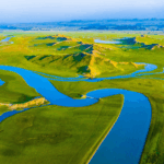 Xinjiang_s_Bayanbulak_Grassland__A_Serene_Natural_Masterpiece - Khabar Asia Xinjiang_s_Bayanbulak_Grassland__A_Serene_Natural_Masterpiece
