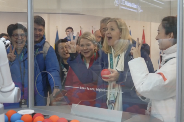 IOC_President_Engages_with_Chinese_AI_at_Milan_2026_Tech_Showcase video poster