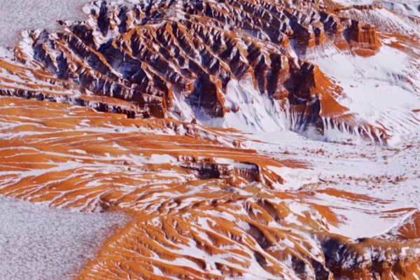 Snow_Meets_Danxia__Inner_Mongolia_s_Mars_Like_Landscape video poster