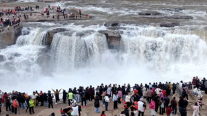 Hukou_Waterfall_s_Spring_Spectacle__Where_Blossoms_Meet_Thunder video poster