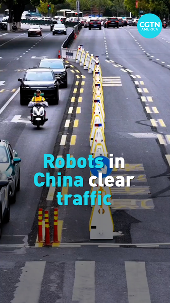 Smart_Robots_Ease_Hangzhou_Traffic_with_Adaptive_Lane_Tech video poster